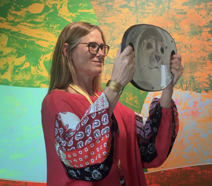 Portrait of digital media artist and net pioneer Lisa Jevbratt, overlaid with abstract computer graphics data visualization.