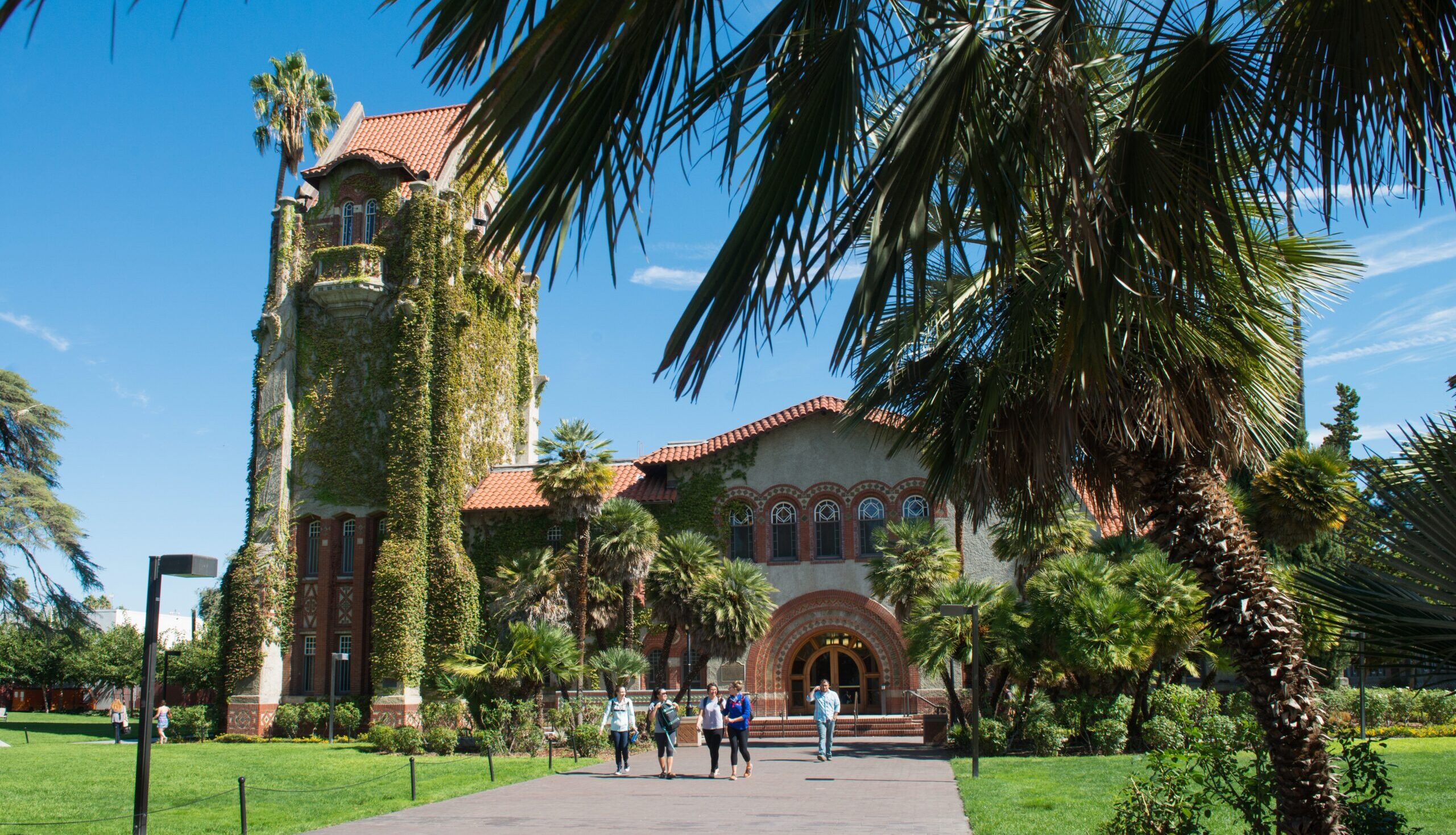 Students walking on campus at San Jose State University. Image from San Jose Spotlight story