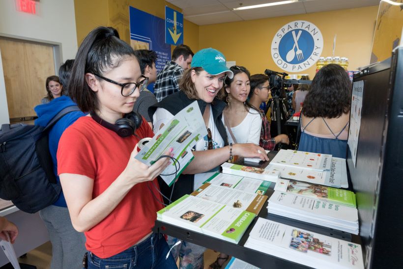 Student Resources Students receiving resources on campus