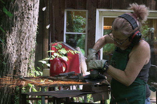 Woman with Angle Grinder