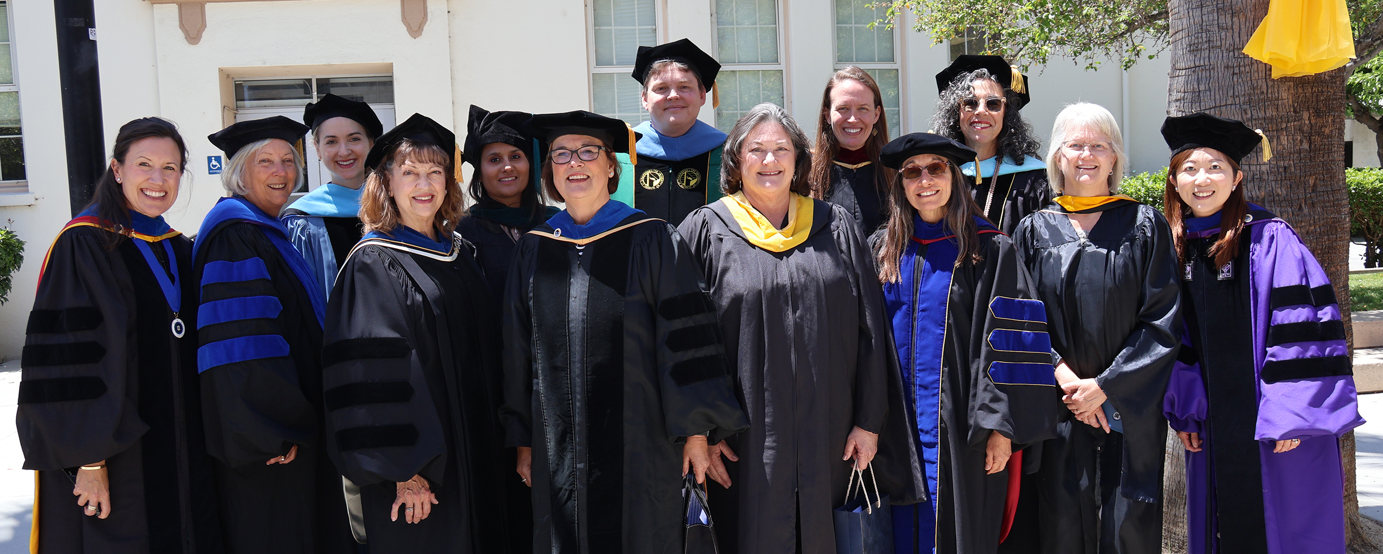 OT faculty group photo in 2024 OT faculty in graduatioon regalia group photo in 2024