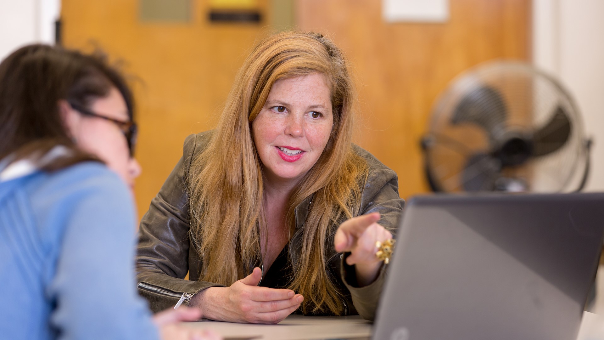 Academic advising working with a student