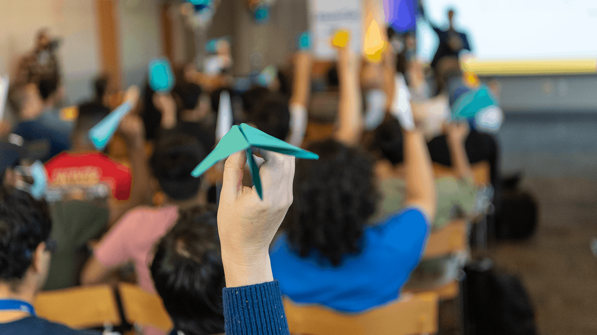 Student flying a paper airplane