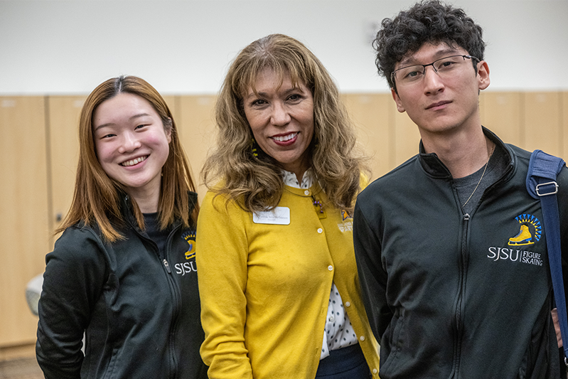 President Cynthia Teniente-Matson poses for a photo with the SJSU Figure Skating Club