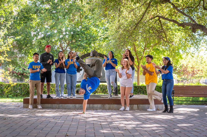 Studnets hanging out and dancing on campus